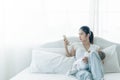 Single busy mother feeding to baby while busy with call.  Newborn baby being breastfed by mother Royalty Free Stock Photo