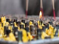 Single candle burning at Buddhist temple in Thailand