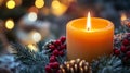 A Single Candle Burning in a Christmas Wreath Royalty Free Stock Photo