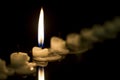 Single candle burning in the darkness Royalty Free Stock Photo