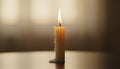 A single candle burning softly in warm ambient light symbolizing peace reflection and remembrance Royalty Free Stock Photo