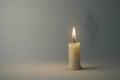 A single candle burns in silence. Space for text. Royalty Free Stock Photo