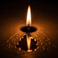 A single candle flame burns brightly against a dark background Royalty Free Stock Photo