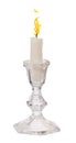 Single candle with flame in candlestick Royalty Free Stock Photo