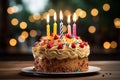 Single candle flickers atop a scrumptious birthday cake centerpiece