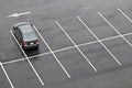 Single car in empty parking lot Royalty Free Stock Photo