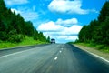 Single car on speed way through wild forest Royalty Free Stock Photo