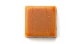 Single caramel candy piece isolated on a white background, top view Royalty Free Stock Photo
