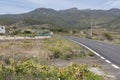 Single carriage road passing through the rural areas surrounded by fincas, agricultural fields and vineyards in Tenerife Royalty Free Stock Photo