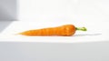 Single Carrot on White Surface Royalty Free Stock Photo