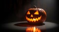 Glowing Jack-o\'- Lantern with Carved Scary Face and Candle Inside on Dark Surface halloween Royalty Free Stock Photo