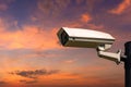 Single CCTV Security camera on beautiful sunrise sky Royalty Free Stock Photo
