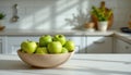 A single ceramic bowl filled with fresh green apples placed on a spacious bright kitchen counter wit Royalty Free Stock Photo