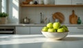 A single ceramic bowl filled with fresh green apples placed on a spacious bright kitchen counter wit Royalty Free Stock Photo