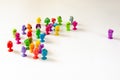 A single character faces a group of figures. Colorful rubber monster figurines on white background