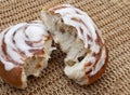 Single Chelsea bun on rustic table Royalty Free Stock Photo