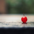 A single cherry on a table, AI