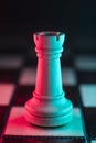 Single chess tower. Good or bad side. Red and blue light Royalty Free Stock Photo