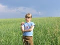 Single child under dark storm sky