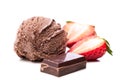 Single chocolate ice cream scoop with chocolate and strawberry slices Royalty Free Stock Photo