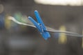 Single clothes pin with blured background Royalty Free Stock Photo
