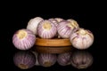 Single clove garlic isolated on black glass Royalty Free Stock Photo