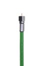 Single coaxial green cable with connector Royalty Free Stock Photo