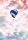 Single, colorful hot-air balloon high in the sky