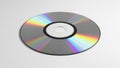 A single compact disc reflects rainbow colors against a plain white background Royalty Free Stock Photo