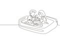 Single continuous line drawing boy and girl of preschool age are playing in sandbox. Two little kids making sandcastle in sandbox Royalty Free Stock Photo