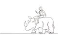 Single continuous line drawing businesswoman riding rhinoceros symbol of success. Business metaphor concept, looking at goal,