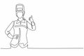 Single continuous line drawing female welder with a thumb-up gesture works in the construction of a building forming a steel frame