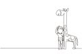 Single continuous line drawing little boy measuring his height with giraffe height chart on wall. Kid measures growth. Child Royalty Free Stock Photo