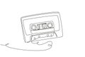 Single continuous line drawing retro compact tape cassette. Vintage music icon audio cassette tape element in doodle style