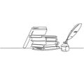 Single continuous line drawing of stack of books, ink and quill pen on the office desk. Old antique writing equipment concept.