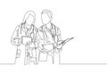 Single continuous line drawing of young couple male female doctors standing and discussing right treatment to sick patient Royalty Free Stock Photo