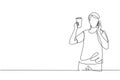 Single continuous line drawing young handsome man drinking orange juice while making phone call with smartphone and having Royalty Free Stock Photo