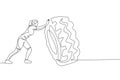 Single continuous line drawing of young sportive woman training lift and push big heavy tire in sport gymnasium club center. Royalty Free Stock Photo