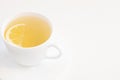 Single cup of tea with half lemon slice isolated on white background copy and space for text Royalty Free Stock Photo