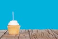 Single cupcake with blue candle Royalty Free Stock Photo