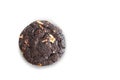 A single dark chocolate cookie with nuts on a white background in a studio shot view Royalty Free Stock Photo