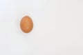 Single dark hen`s egg isolated on white background with copy space Royalty Free Stock Photo