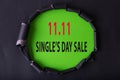11.11 Single day sales. Black circle torn paper with 11.11 Single days sale on Green color background