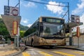 Single deck bus in Hong Kong agaisnt blue sky 14B