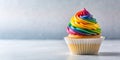 A single delightful rainbow cupcake, swirled frosting, sits on a neutral background. Generative AI Royalty Free Stock Photo