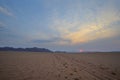 Single dirt tracks straight through the desert to the mountain Royalty Free Stock Photo