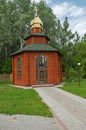 Single domed chapel surrounded by green vegetation