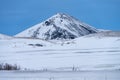 Single dramatic symetrical volcanic,snow covered cone near lake Myvatn, Iceland