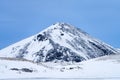 Single dramatic symetrical volcanic,snow covered cone near lake Myvatn, Iceland in mid winter Royalty Free Stock Photo