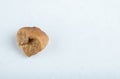 Single dried fig on white background Royalty Free Stock Photo